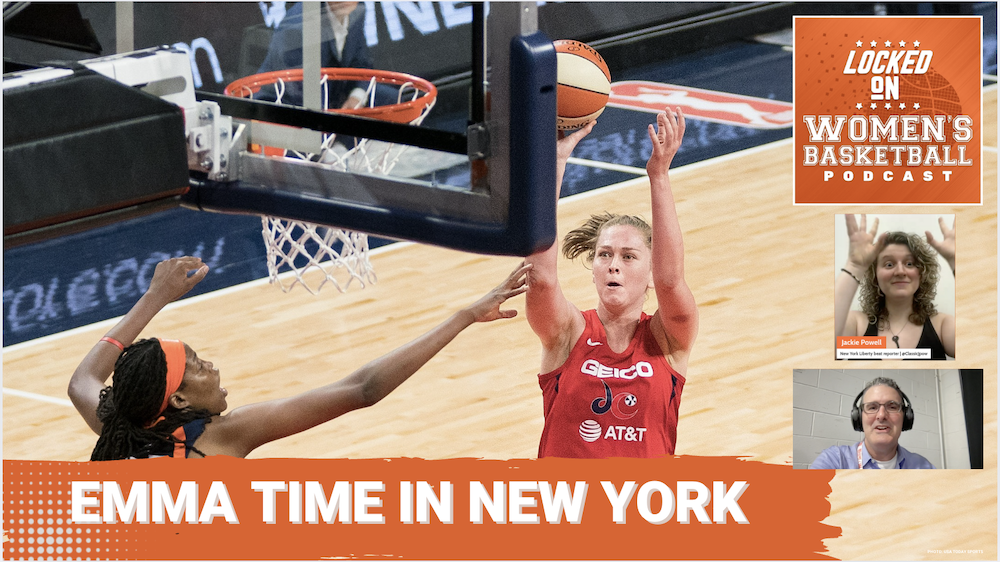 Emma Meesseman takes a shot while a defender reaches her arm out